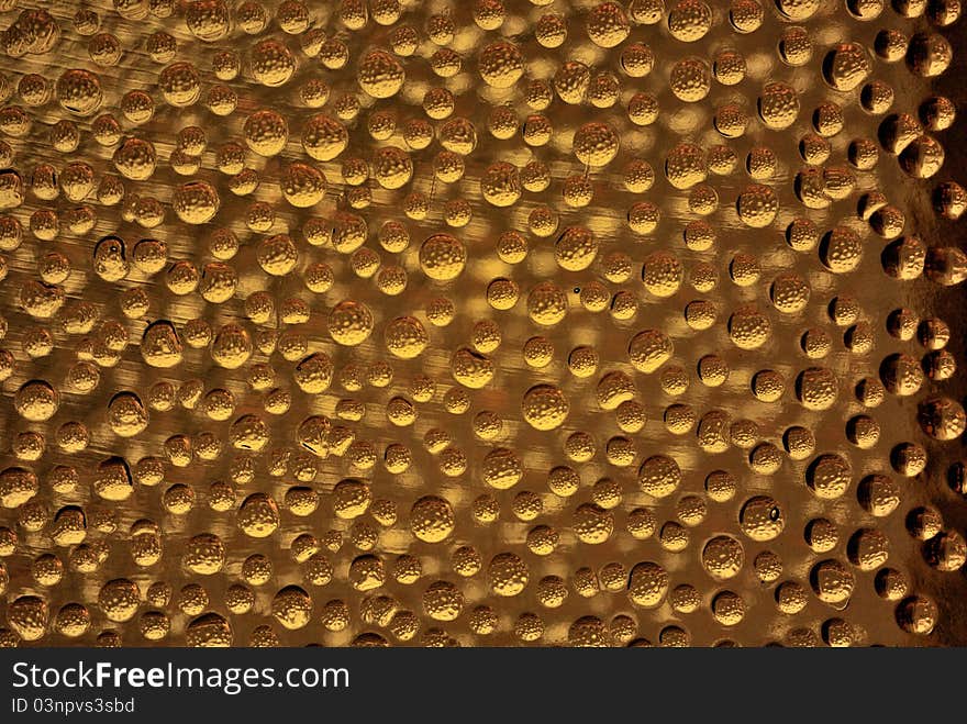 Orange colored bubbles on a glass brick. Orange colored bubbles on a glass brick