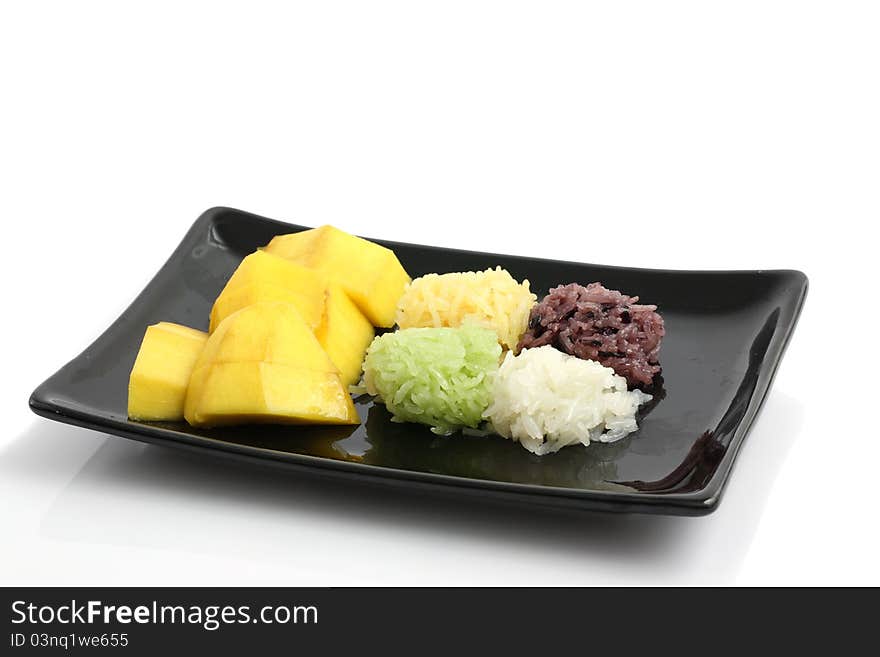 Mango with rice dessert isolated in white background