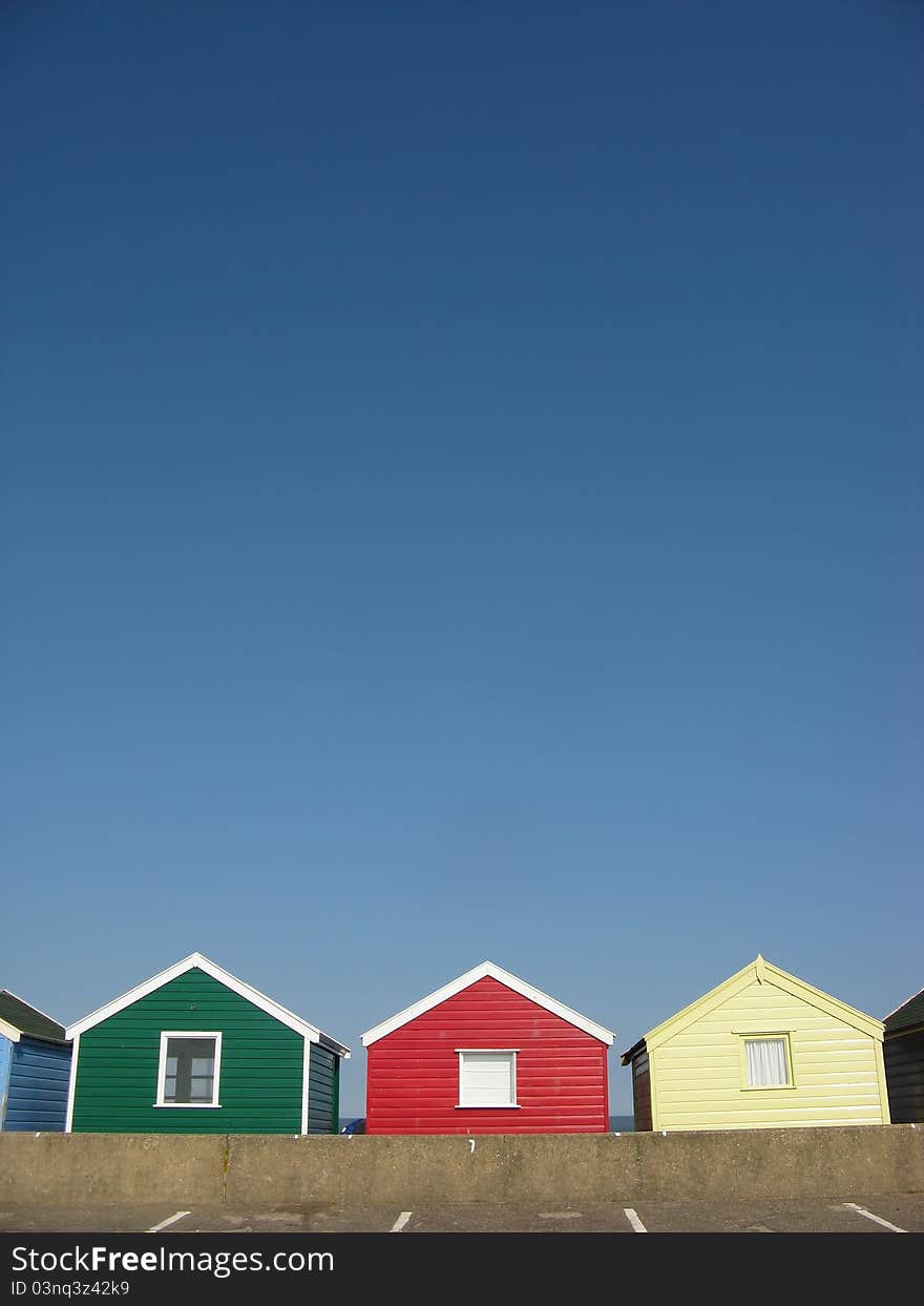 Cheerful Beach Huts On An English Beach