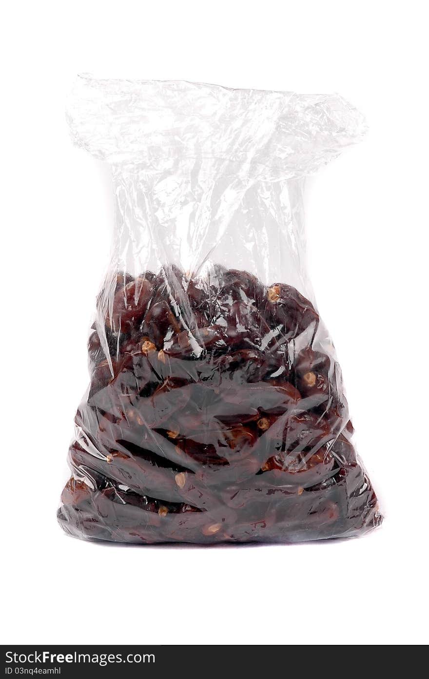 Date palm fruit in a plastic bag packaging isolated on white background