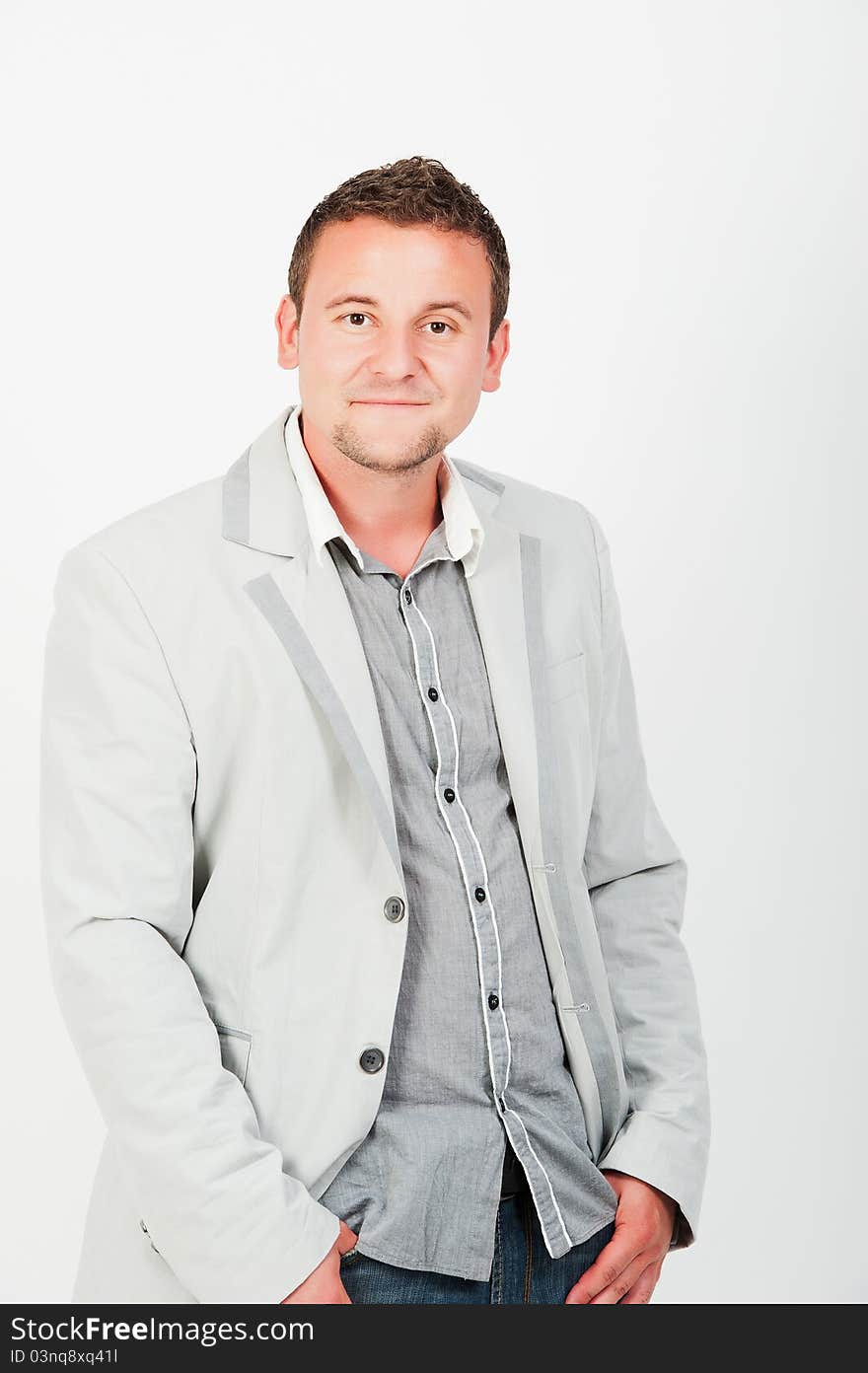 Portrait of happy smiling young business man, isolated on white background