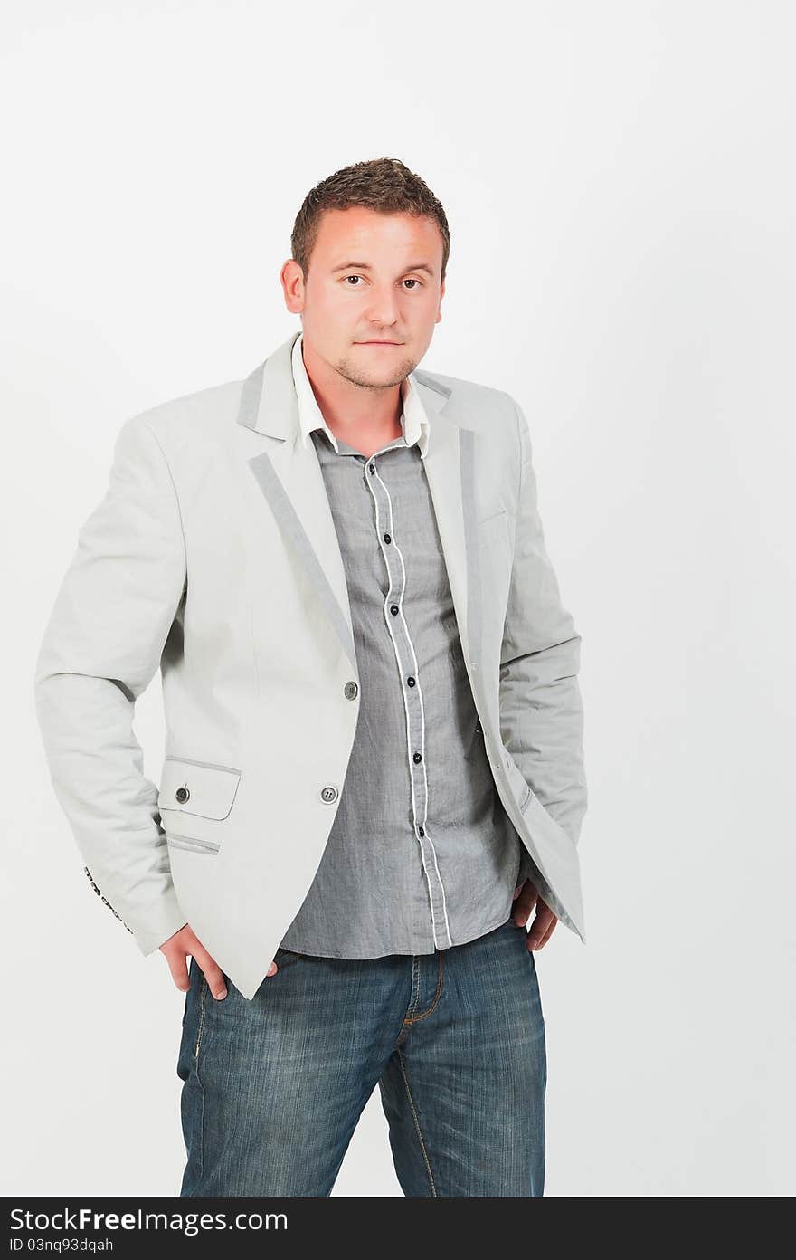 Portrait of happy smiling young businessman, isolated on white background