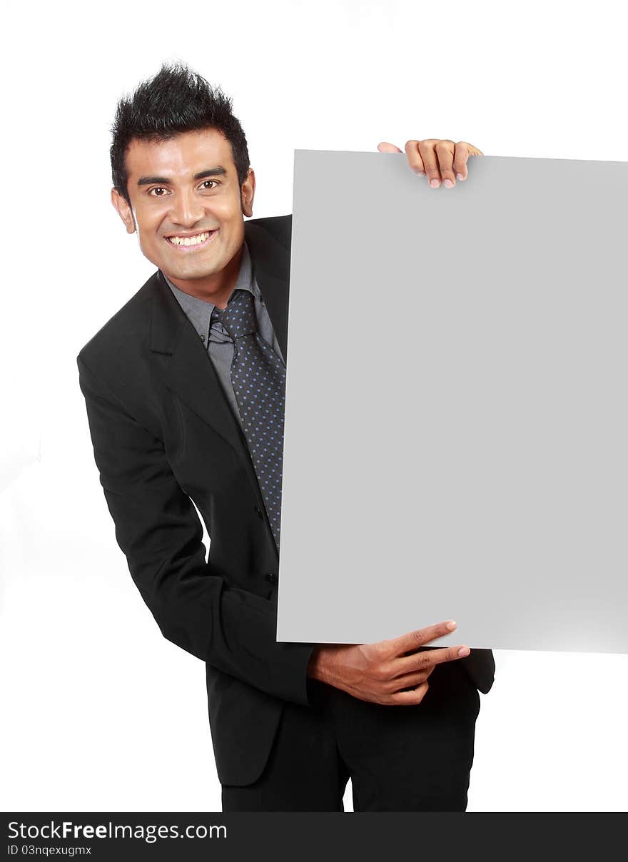 Young Businessman holding a blank sign