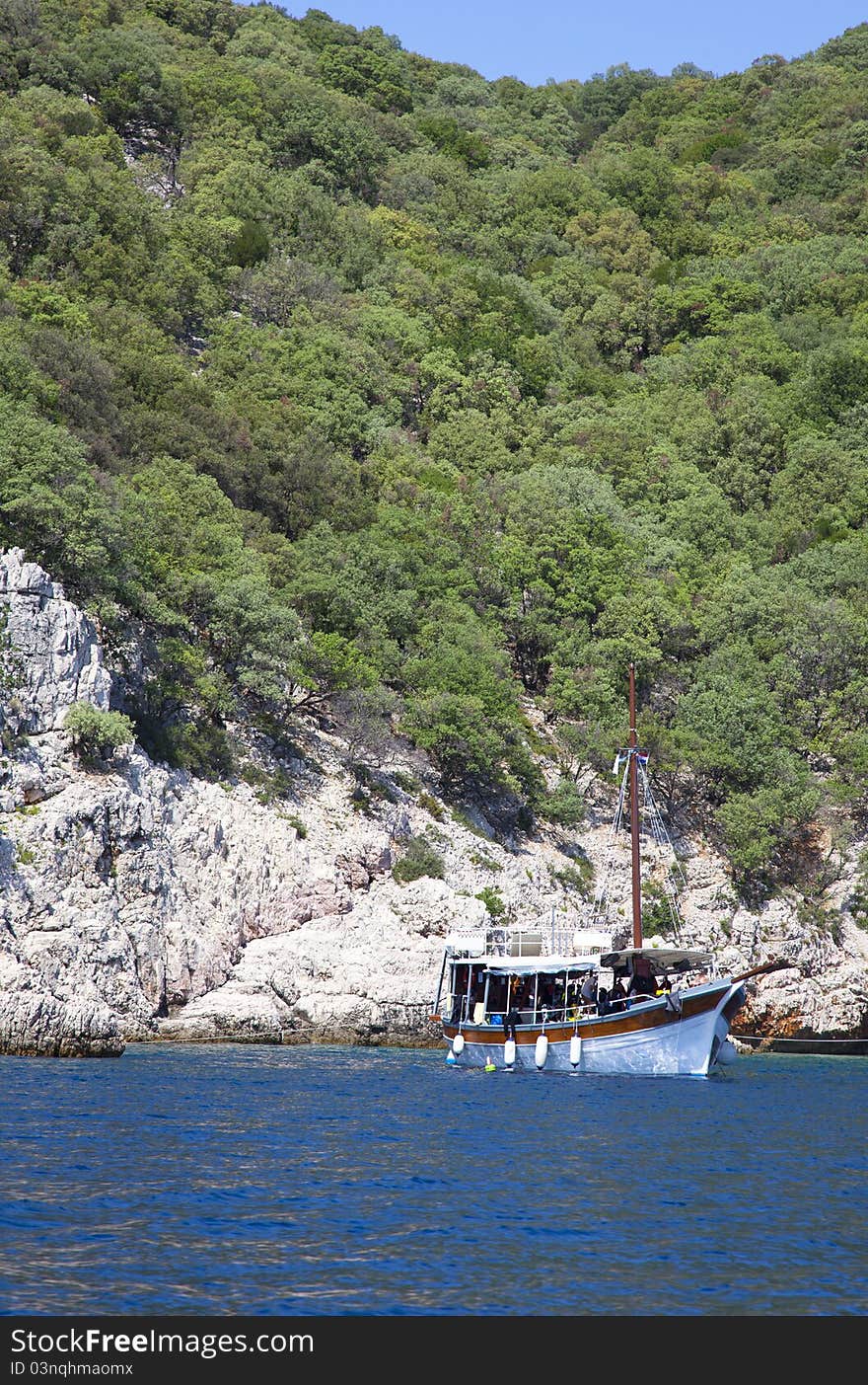 Classic boat anchored in open sea