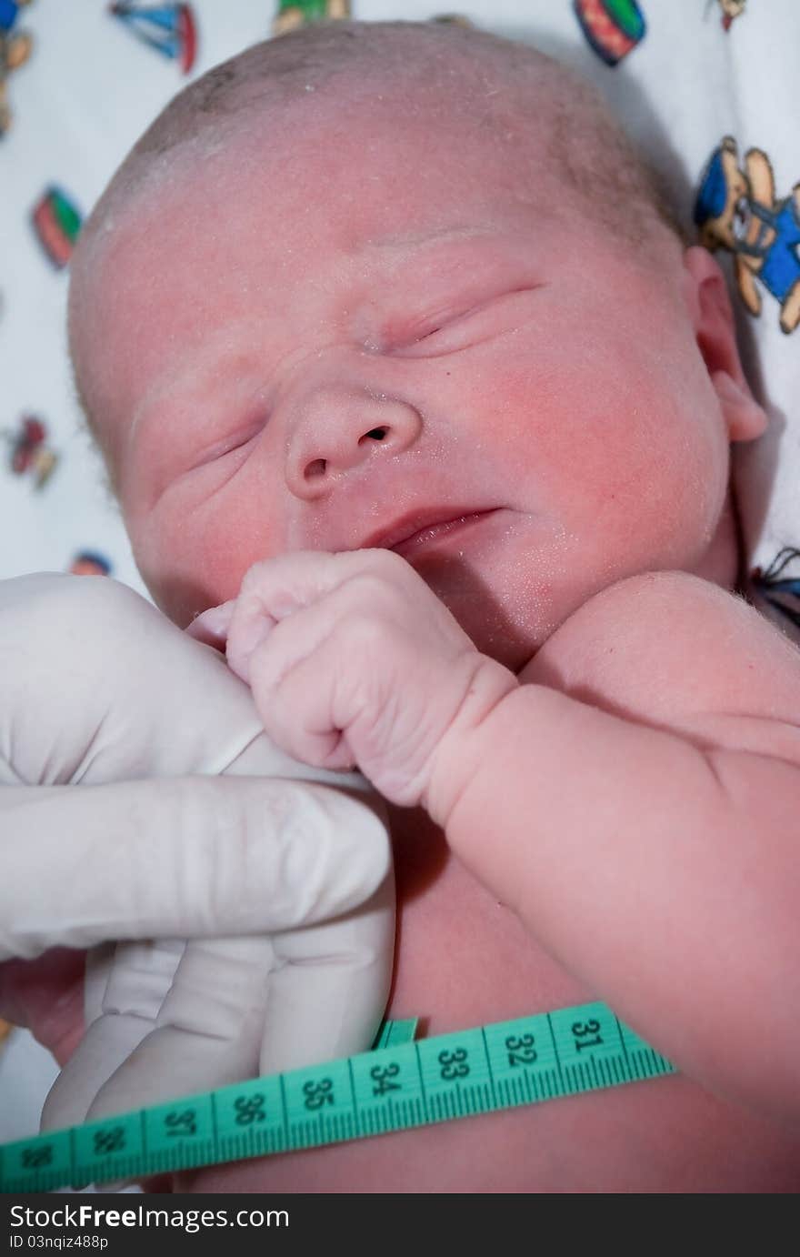 Measure the newborn child closeup