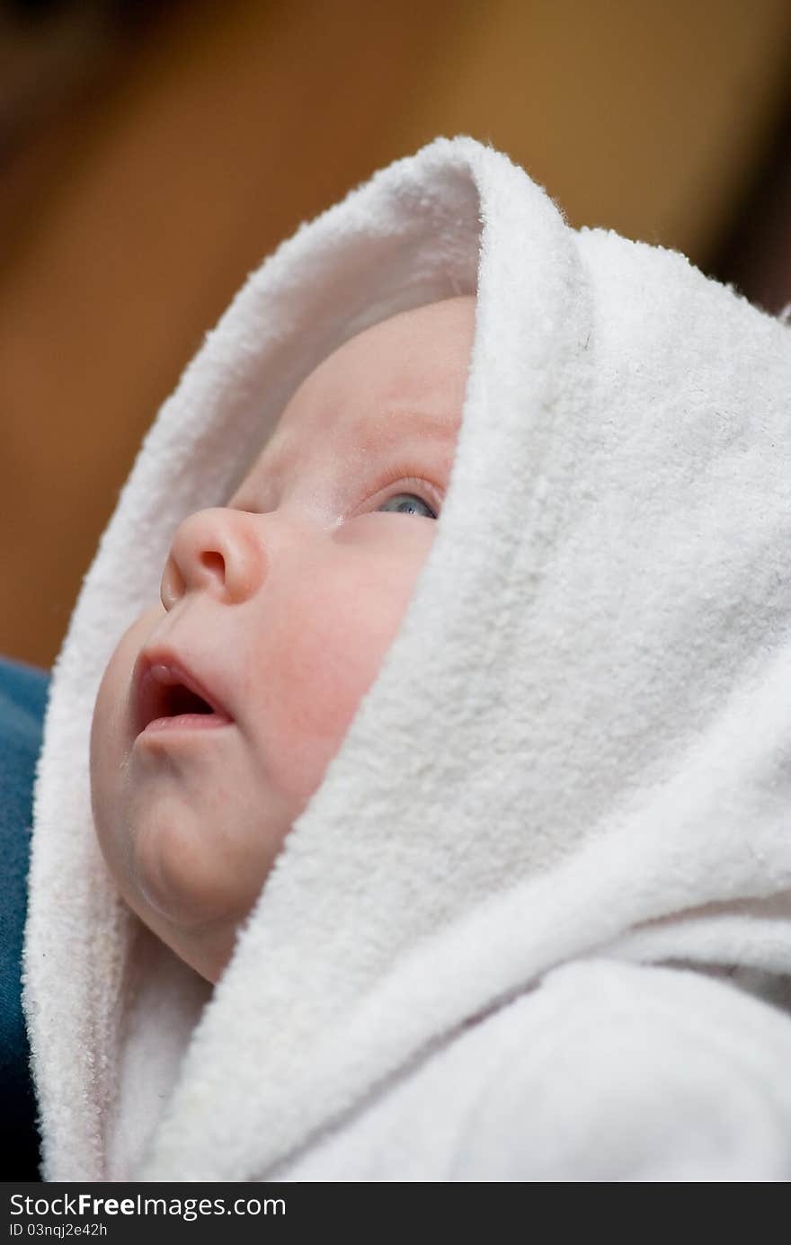 Baby in bath towel closeup