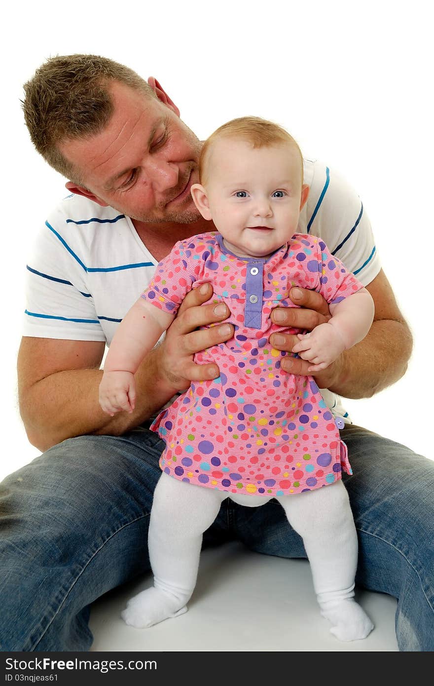 Happy and smiling baby and father. The baby 3 month old. Isolated on a white background. Happy and smiling baby and father. The baby 3 month old. Isolated on a white background.