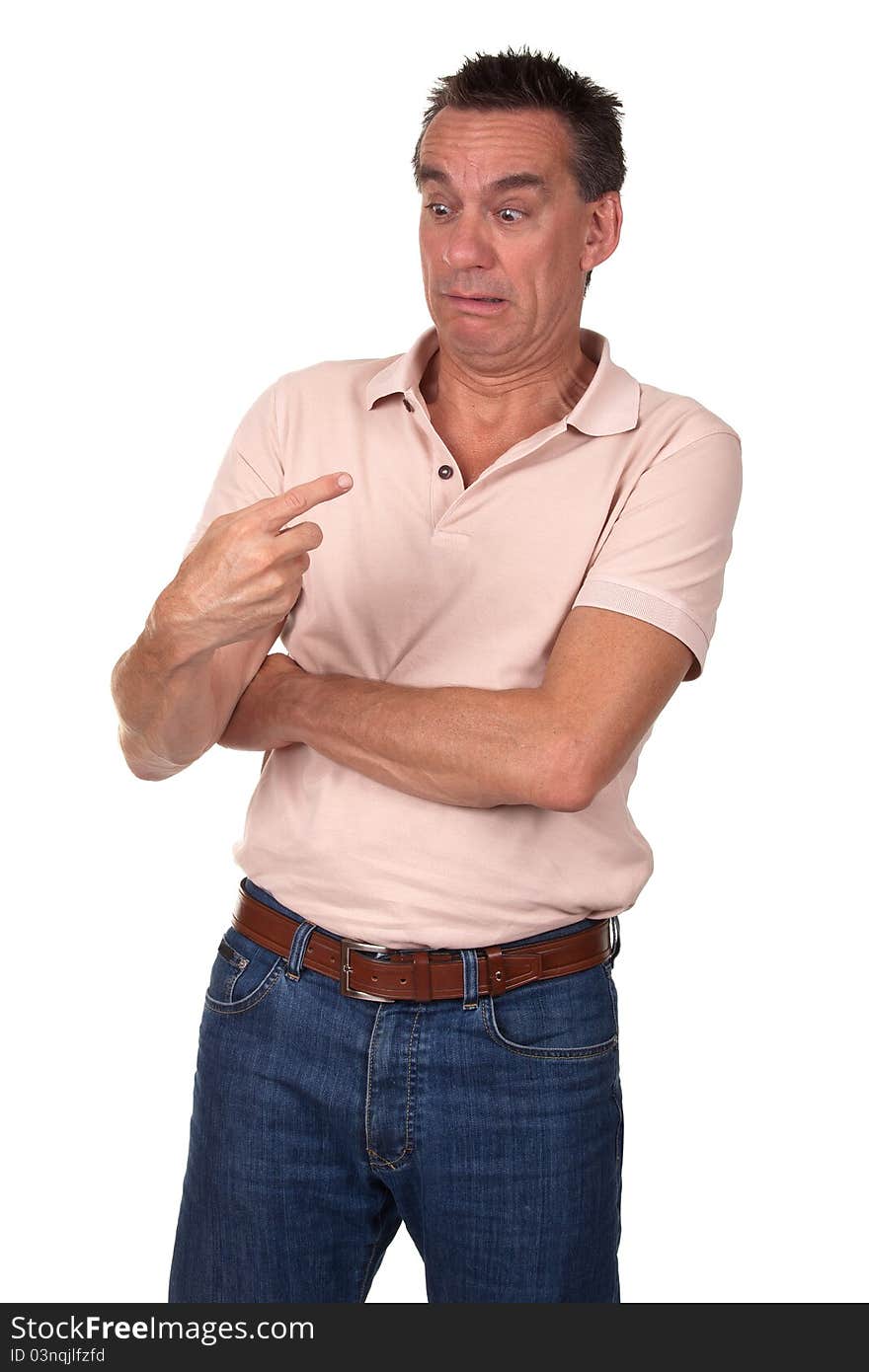 Attractive Middle Age Man Stares in Horror at Something on the End of His Finger. Attractive Middle Age Man Stares in Horror at Something on the End of His Finger