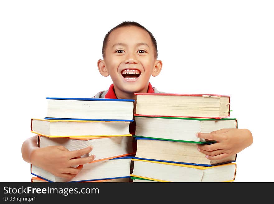 Child smiling with a lot of book on his chest isolated on white background. Child smiling with a lot of book on his chest isolated on white background