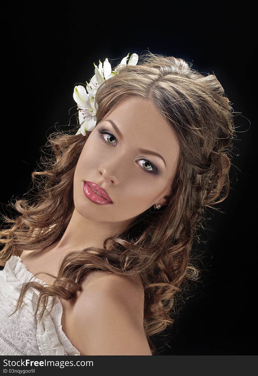 Portrait of beautiful bride with flowers in hair on black. Portrait of beautiful bride with flowers in hair on black