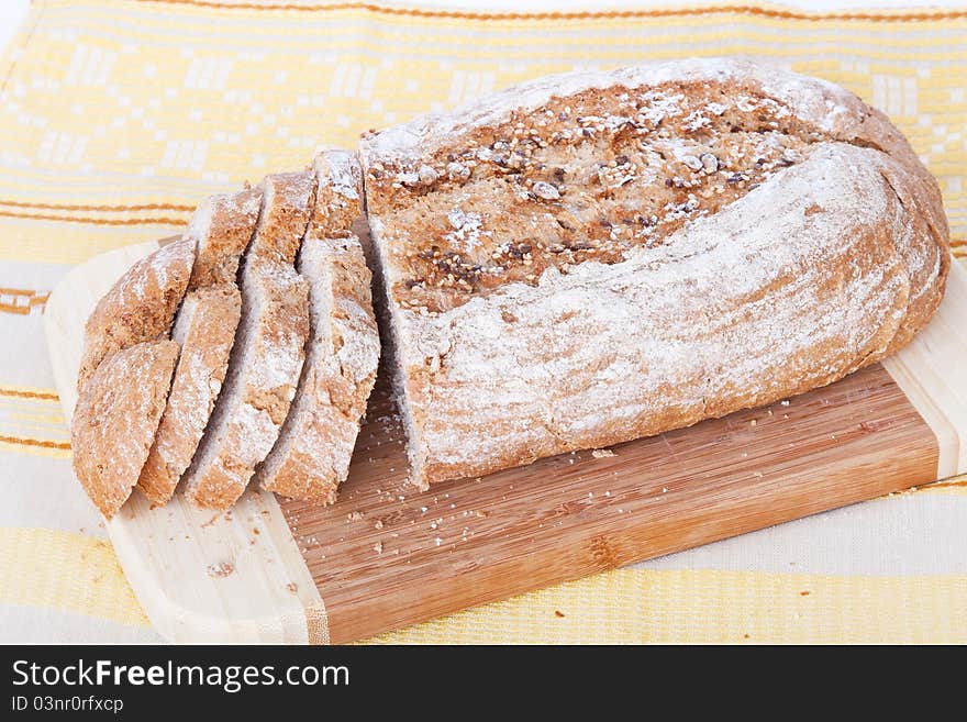 Bread on the wooden board, top view