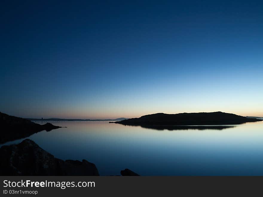 Calm waters amid small islands at sunset in West Cork, Ireland. Calm waters amid small islands at sunset in West Cork, Ireland