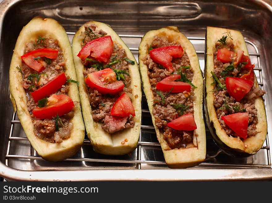 Eggplant stuffed with meat in metal pan