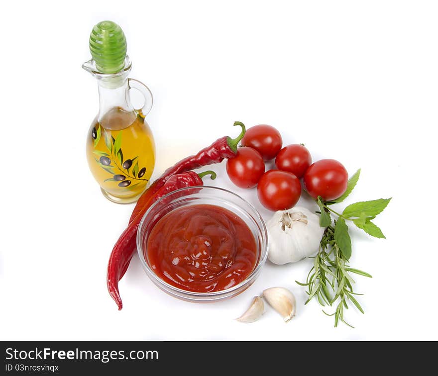 Vegetables and ketchup on white background