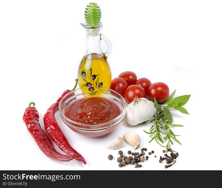 Vegetables and ketchup on white background