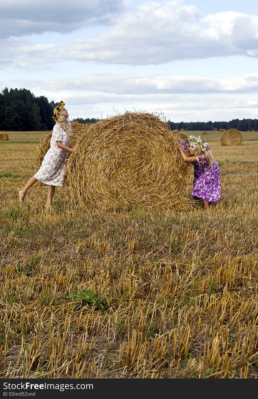 Blondy girls playing on the field. Blondy girls playing on the field