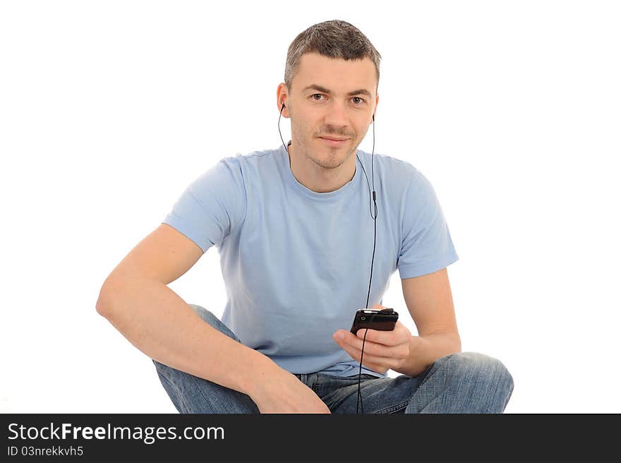 Casual young man with cell phone and headphones