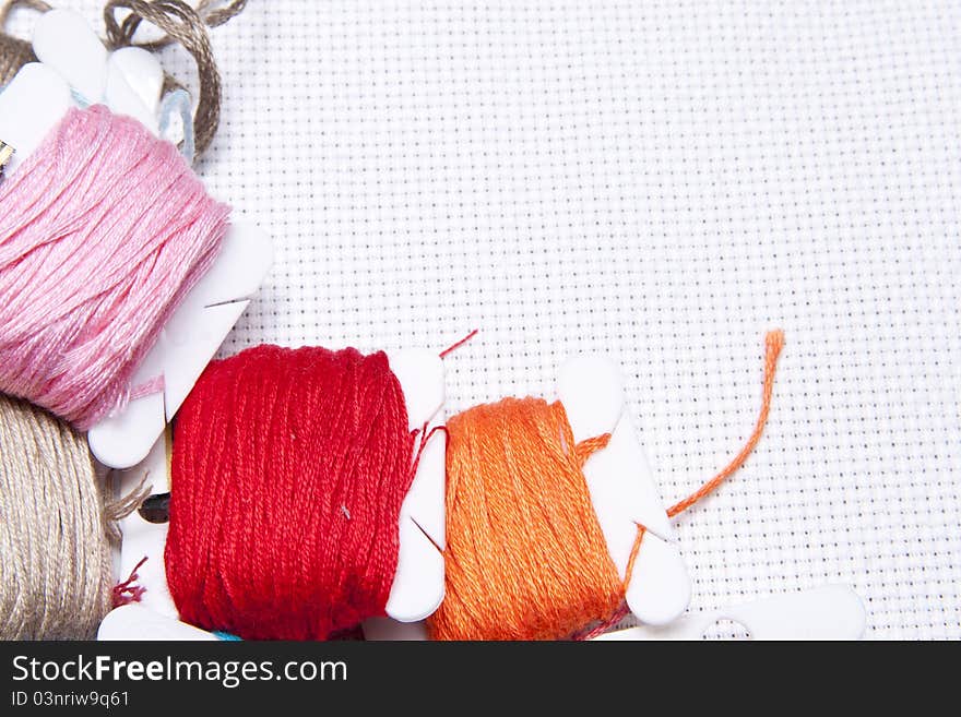 Pile of different coloured bobbins of thread. Pile of different coloured bobbins of thread