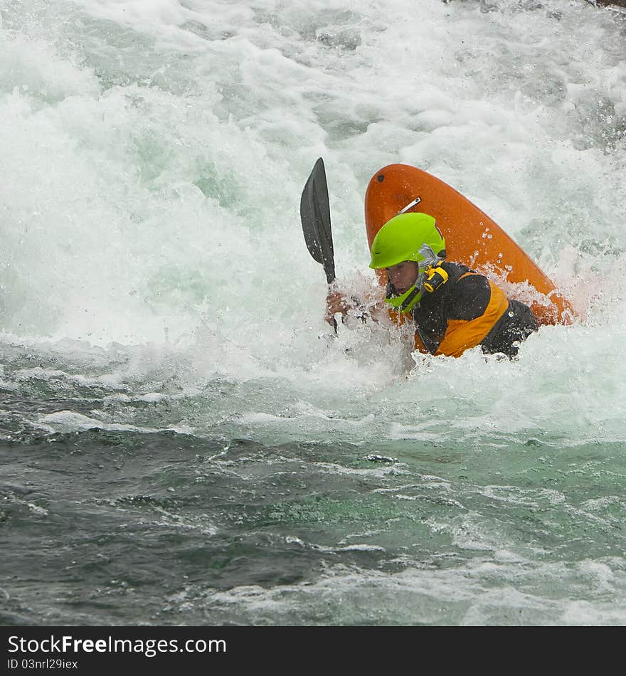 Kayaker after jumping from the waterfall