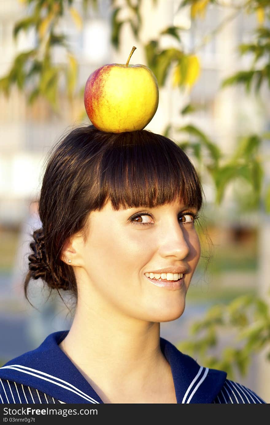 Girl with an apple on the head