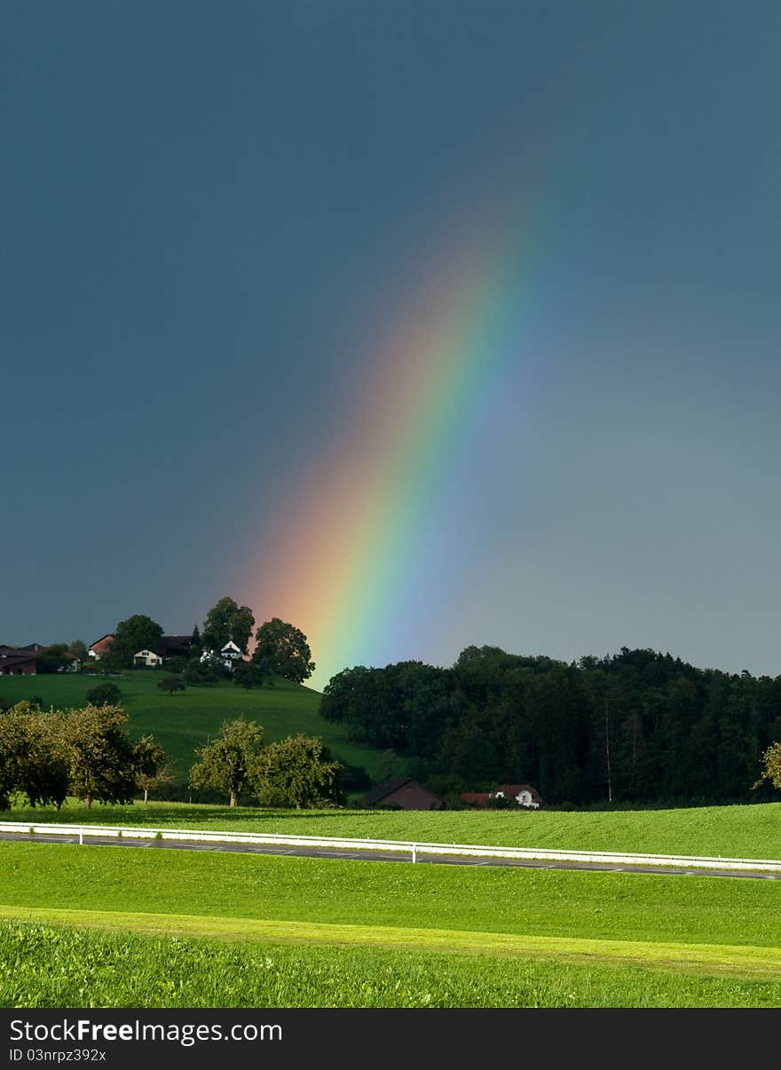 Fading Rainbow across a field. Fading Rainbow across a field