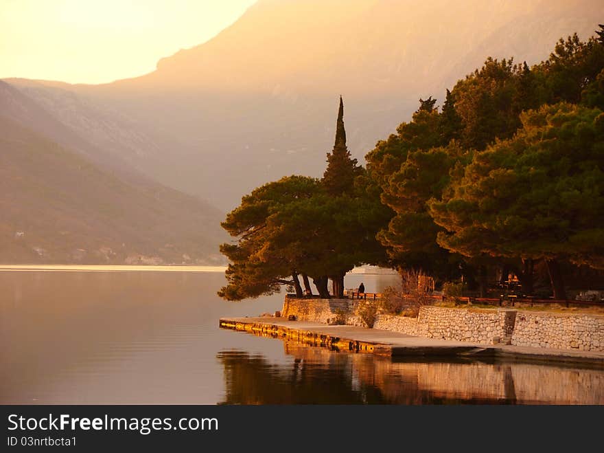 Waterscape with old park on sunset by Perast, Montenegro