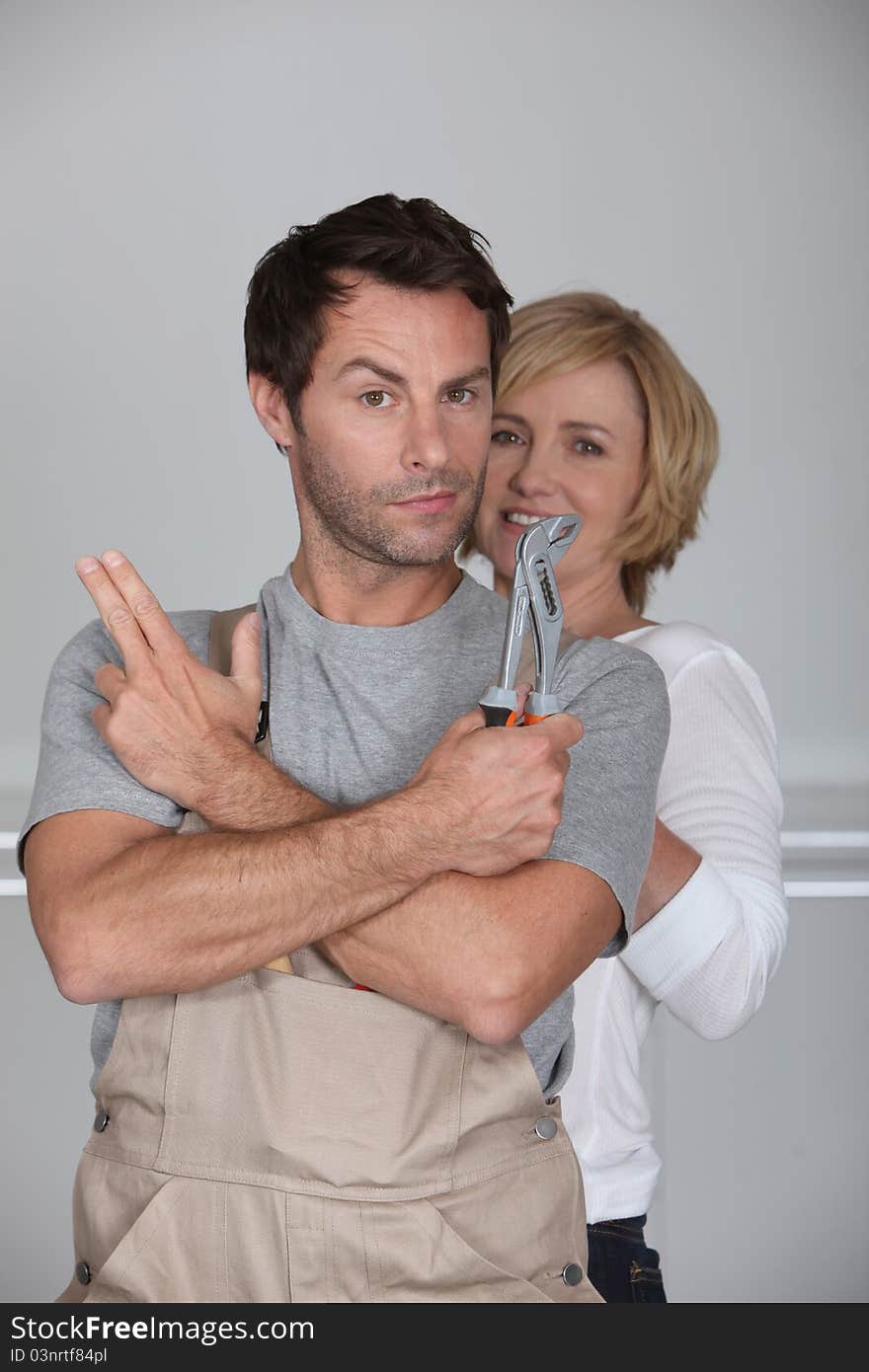 Couple stood together at home