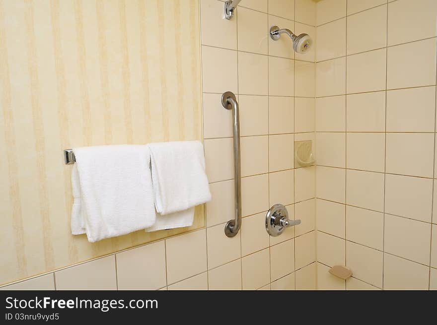 Towels hanging beside shower