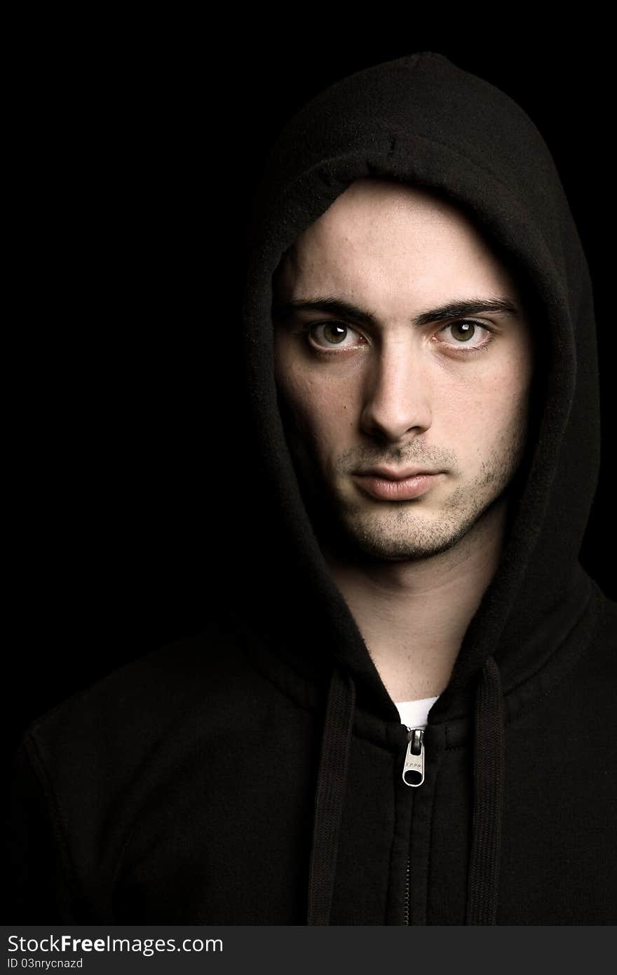 Handsome young man, fashion shot against black background