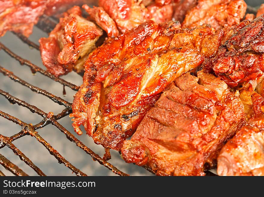 Macro shot of grilling pork. Macro shot of grilling pork