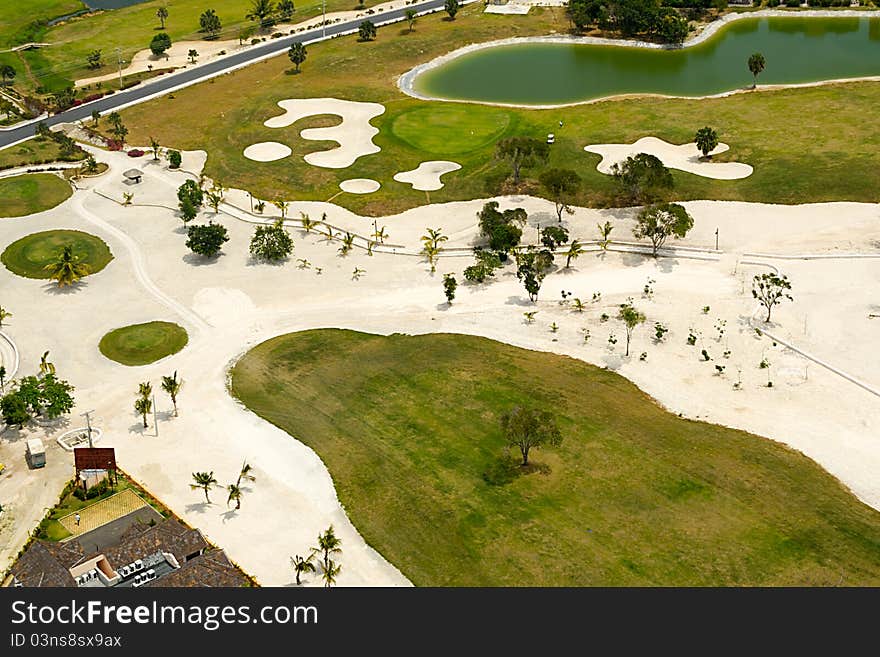 Flying above a golf course at an exotic destination. Flying above a golf course at an exotic destination