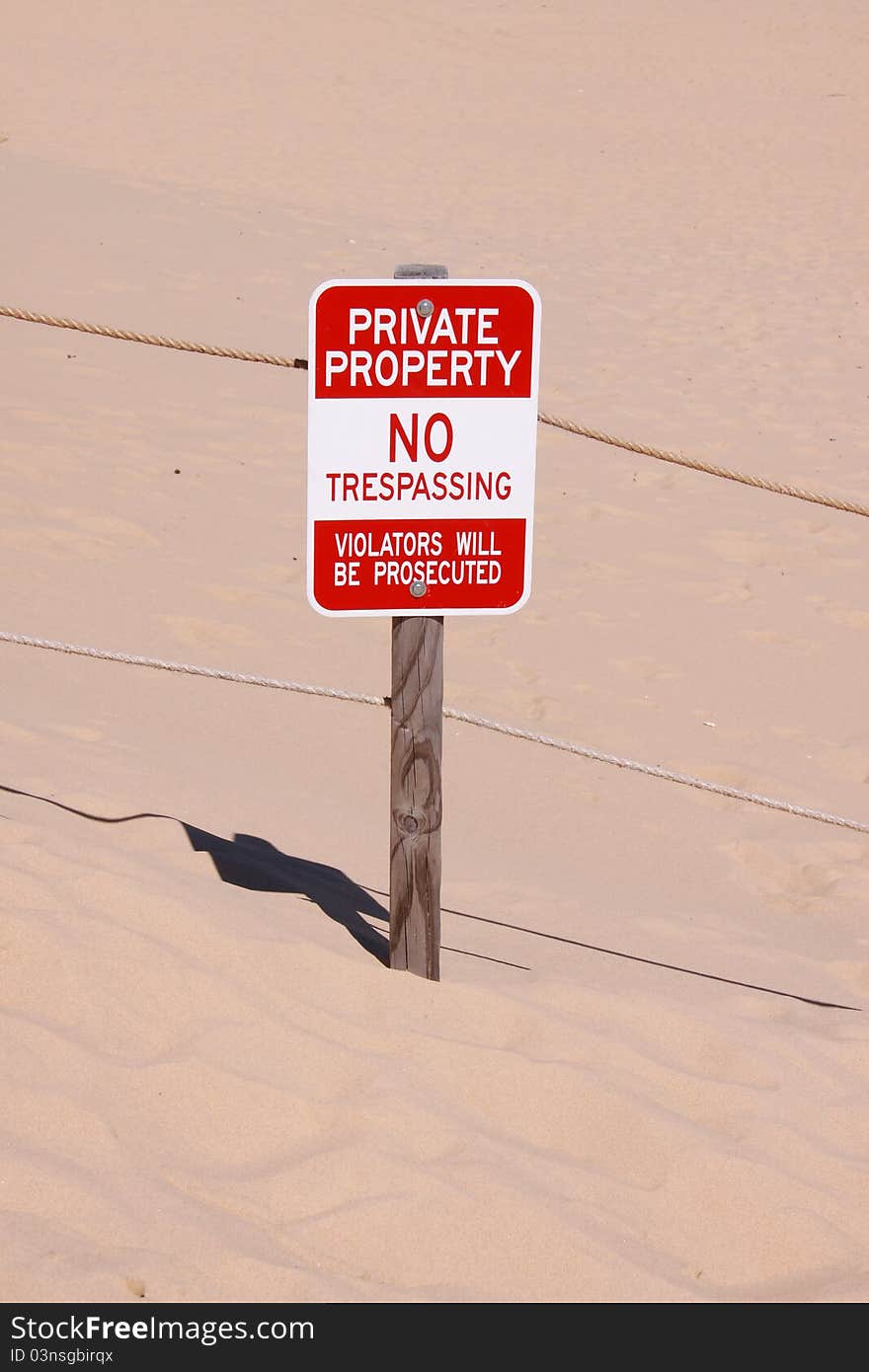 Single Private property board in the middle of sand dunes