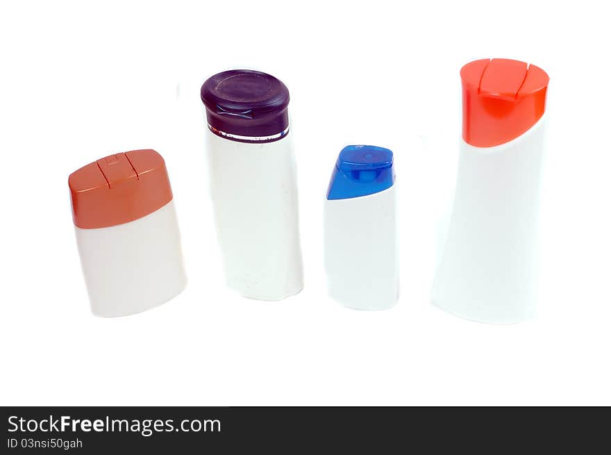 Four plastic containers for bath fixtures isolated on white background