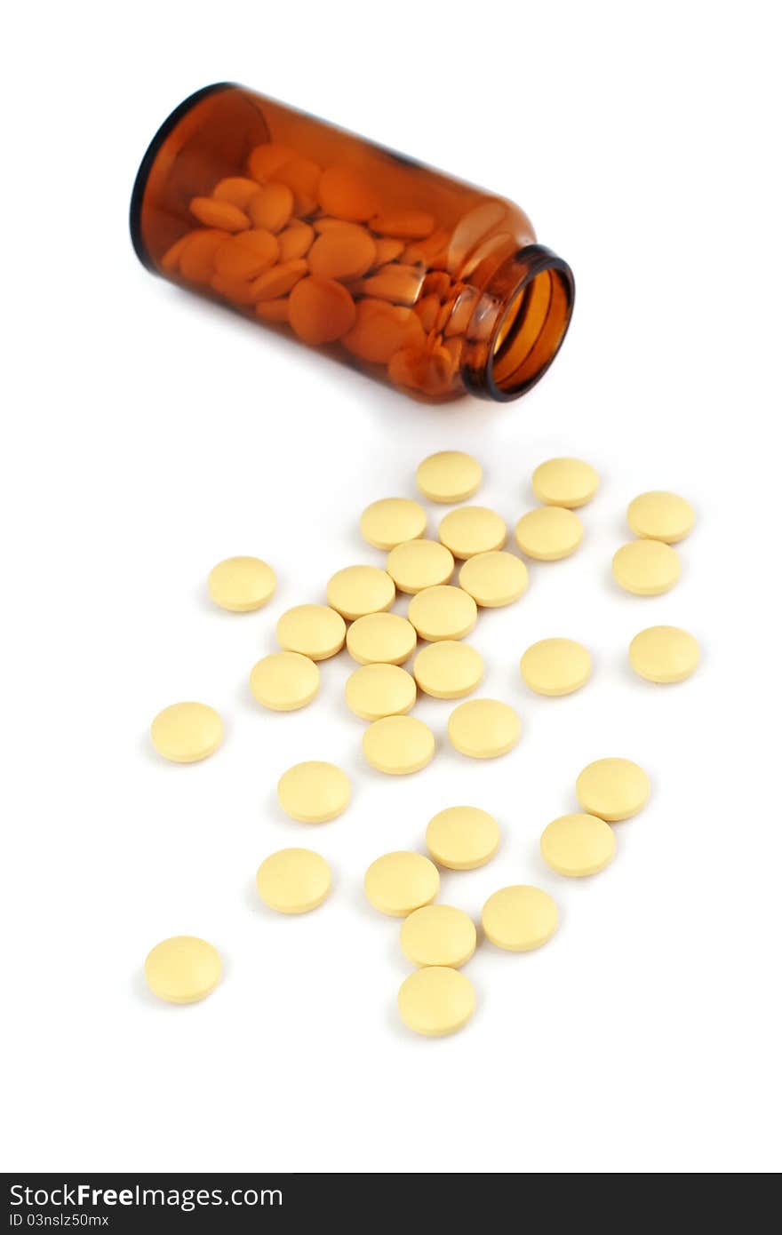 Pills with brown bottle, on white background. Pills with brown bottle, on white background