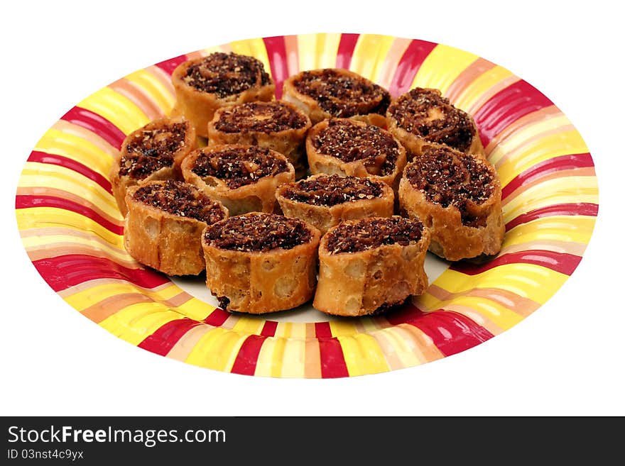 Indian spicy sweet fried snack on a colorful paper plate. Indian spicy sweet fried snack on a colorful paper plate