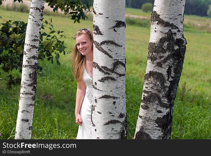 Beauty blonde with trees in summer. Beauty blonde with trees in summer