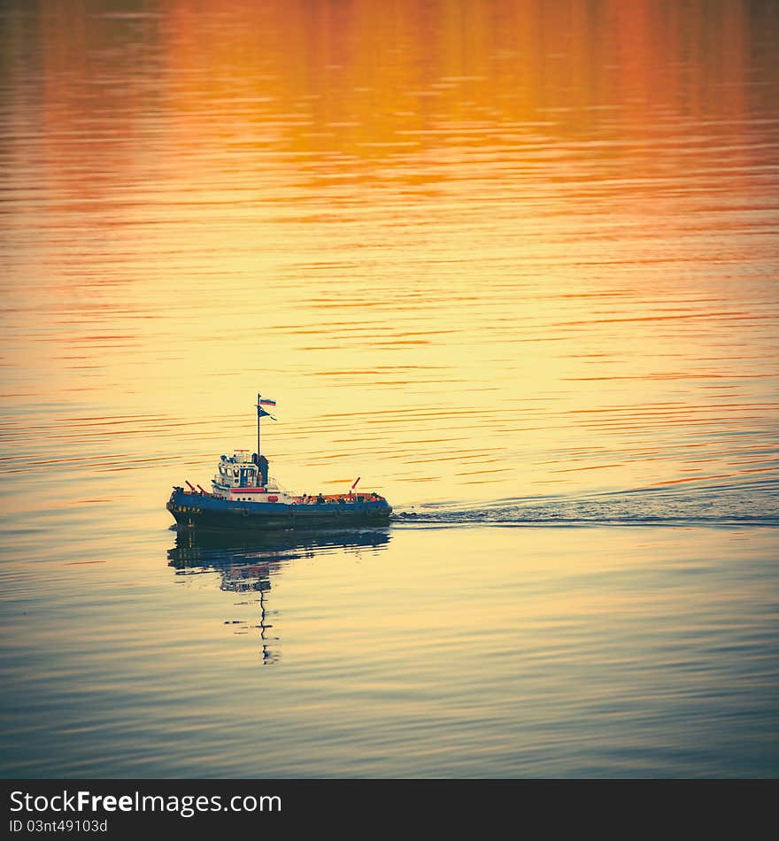 Toy boat with Russian flag colors in the water. Square format. Toy boat with Russian flag colors in the water. Square format.