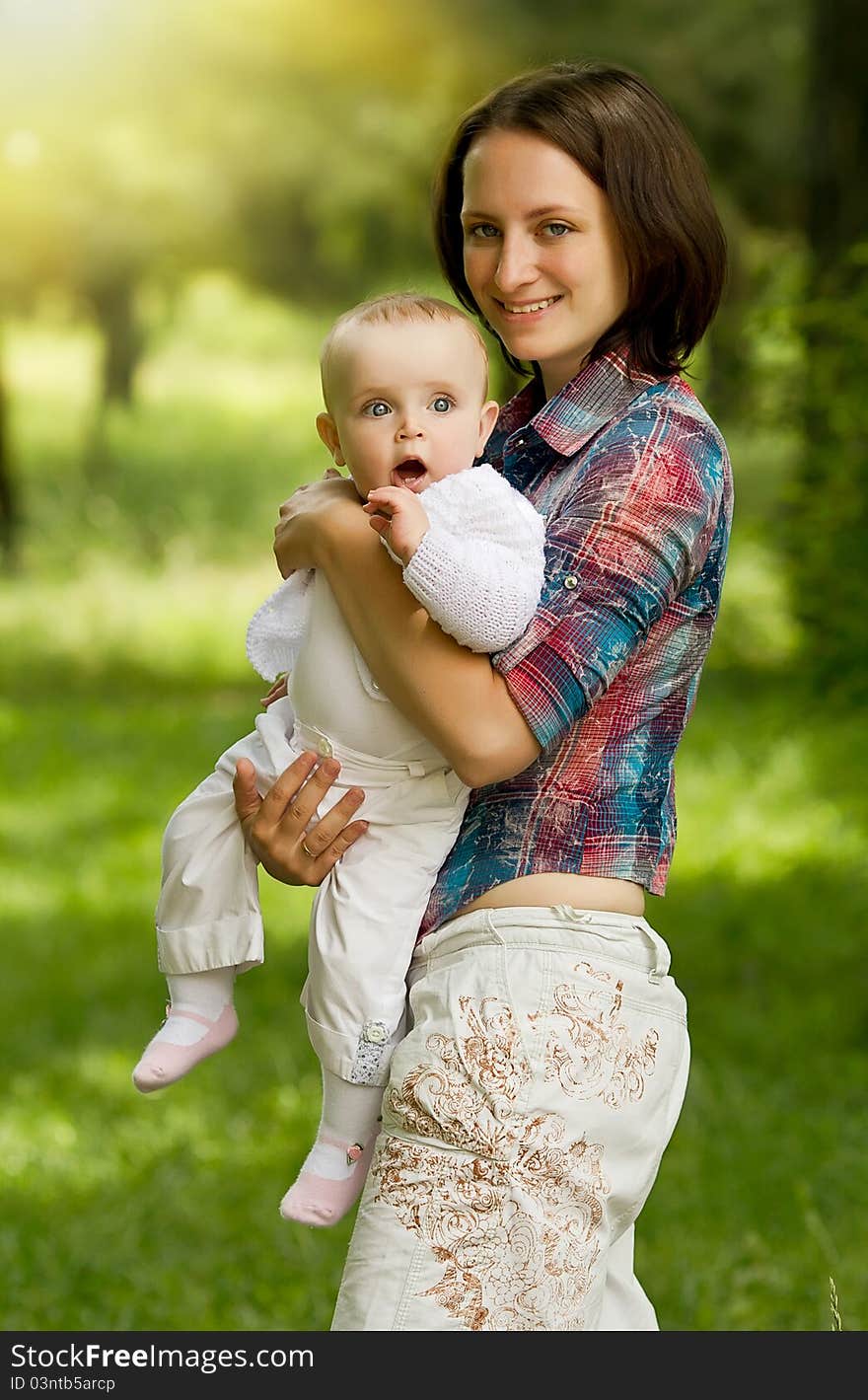 Mother with baby playing in the park