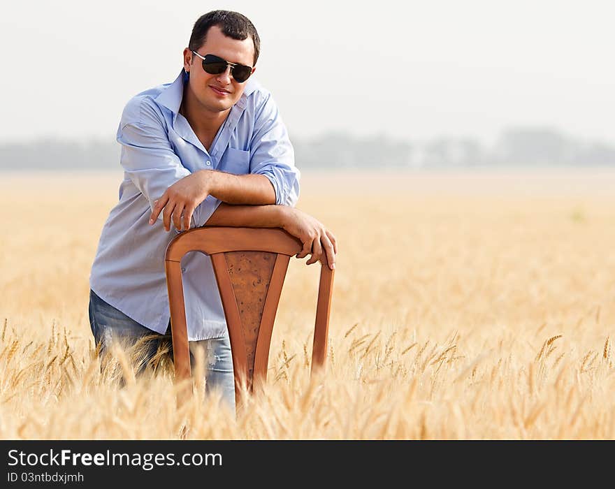 Man in yellow wheat meadow. Man in yellow wheat meadow