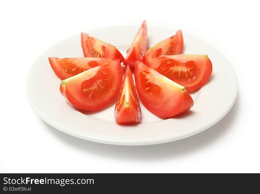 Tomatoes on white porcelain plate. Tomatoes on white porcelain plate