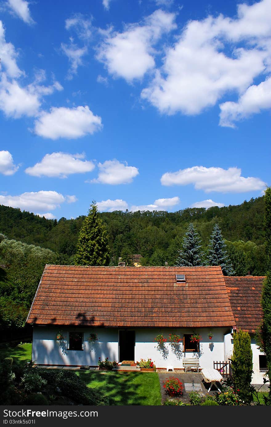 House and cloudy sky