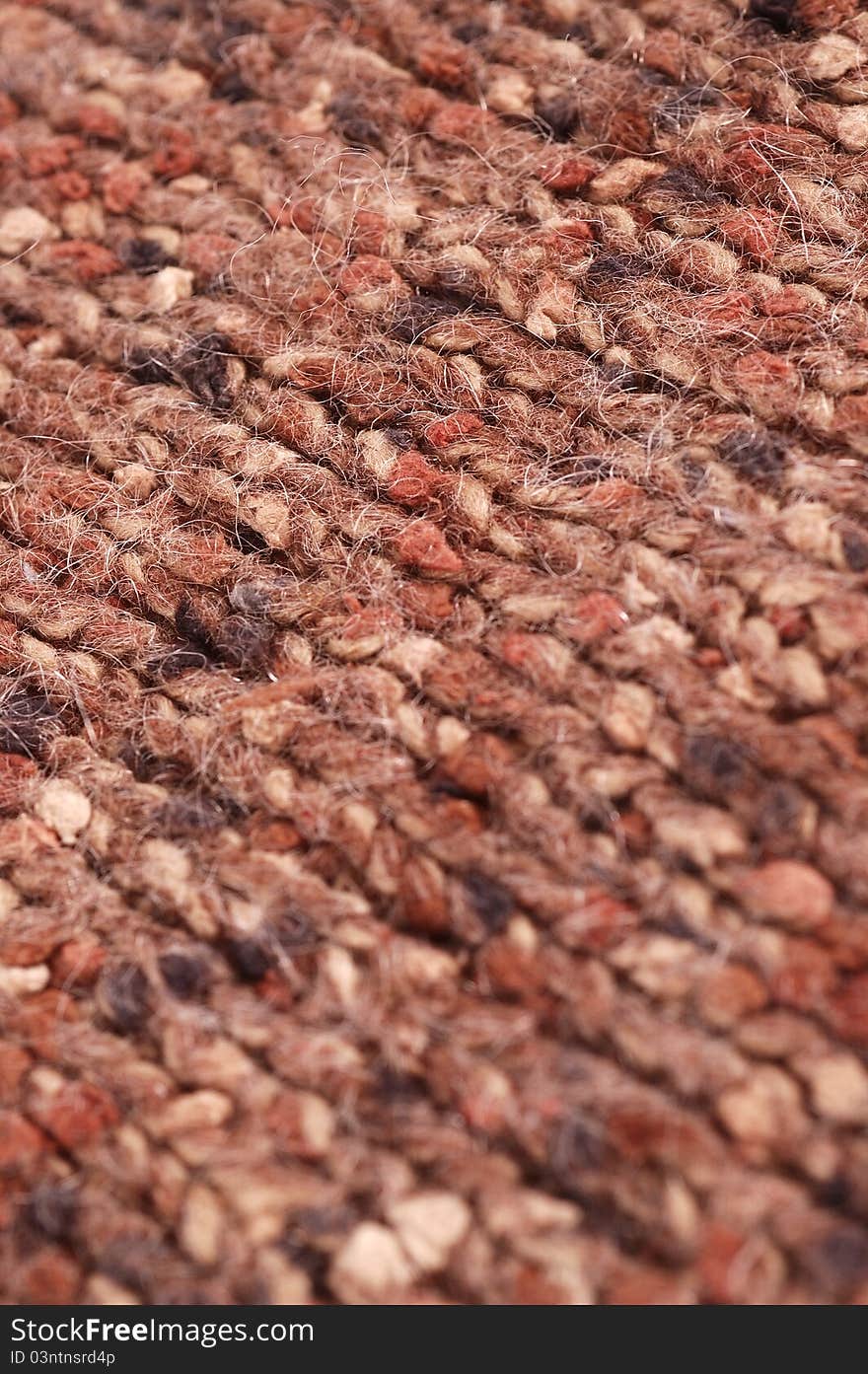 Close up of a brown knitted material. Close up of a brown knitted material