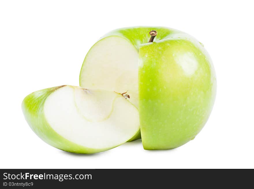 Big green apple with sliced part over white background