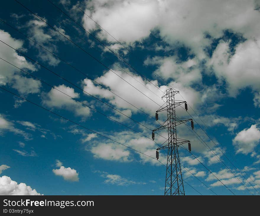 Electric power transmission lines at blue sky