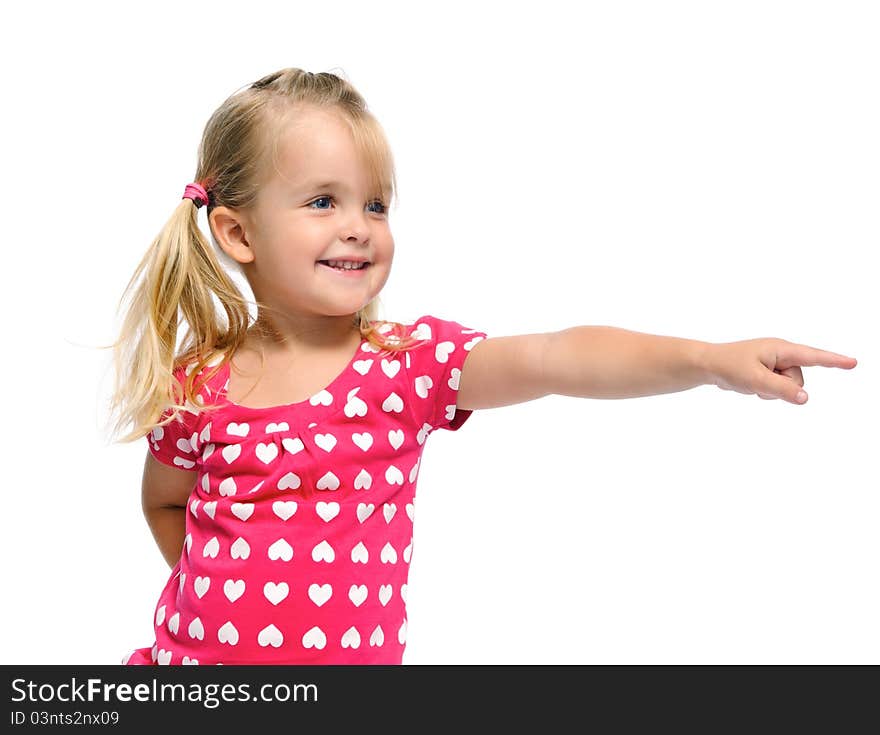 Cute blonde girl with pigtails points in a direction, isolated on white in studio. Cute blonde girl with pigtails points in a direction, isolated on white in studio