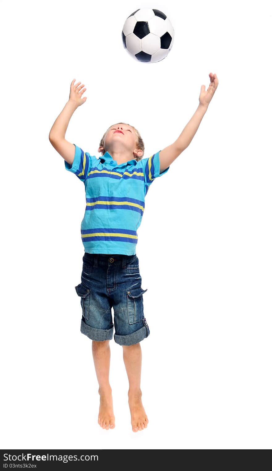 Cute boy throws and jumps with a football in studio, isolated on white. Cute boy throws and jumps with a football in studio, isolated on white