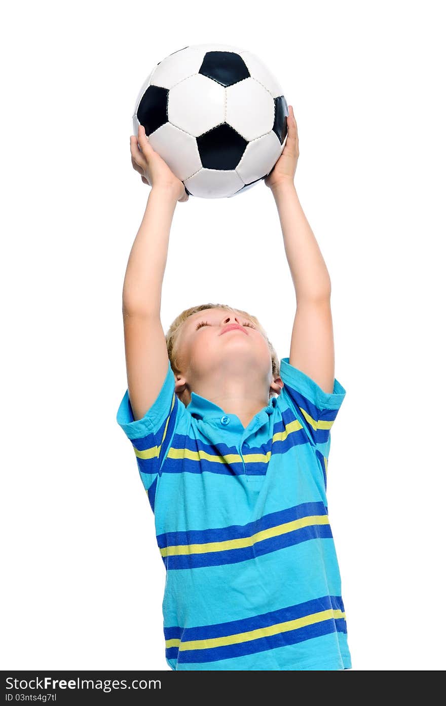 Cute boy plays with a football in studio, isolated on white. Cute boy plays with a football in studio, isolated on white