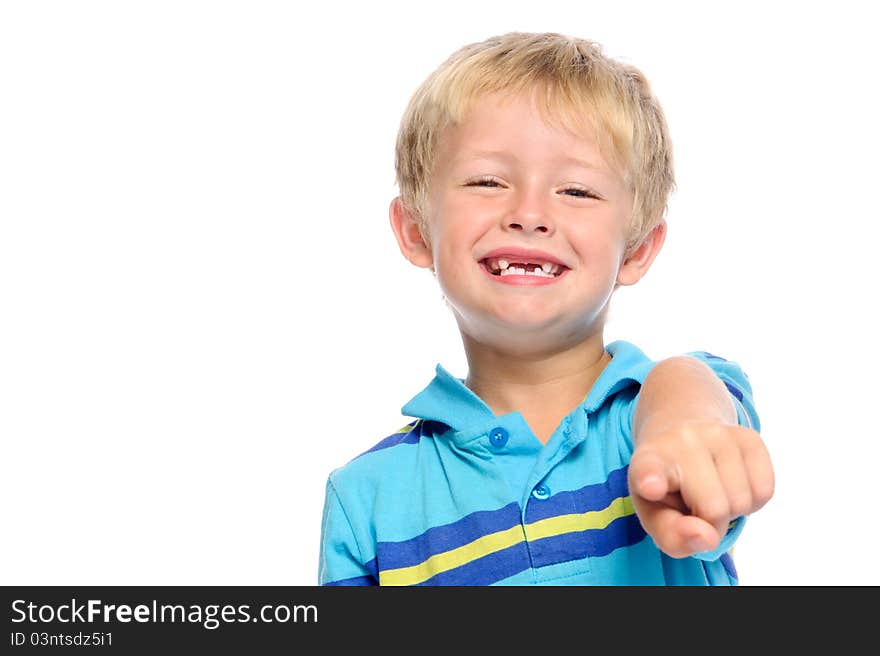 Cute boy in blue shirt pointing at viewer. Cute boy in blue shirt pointing at viewer