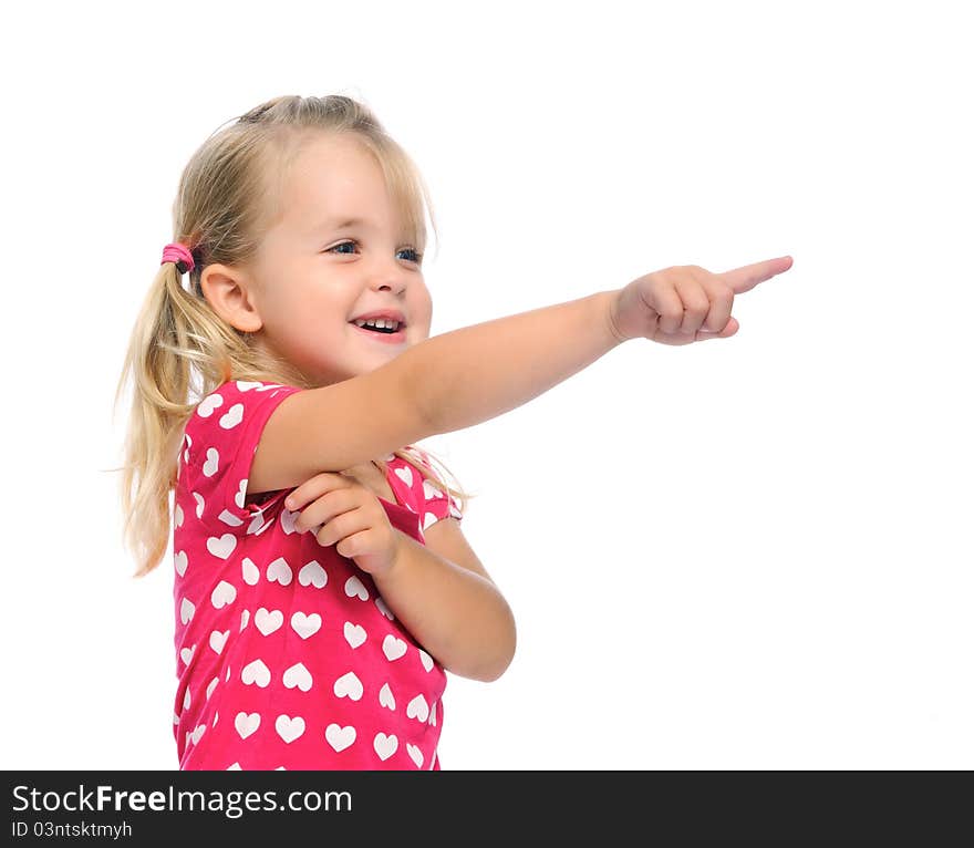 Cute blonde girl with pigtails points in a direction, isolated on white in studio. Cute blonde girl with pigtails points in a direction, isolated on white in studio