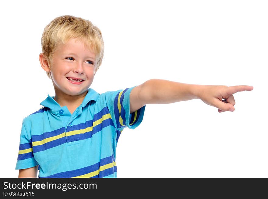 Cute boy in blue shirt pointing at something off frame. Cute boy in blue shirt pointing at something off frame